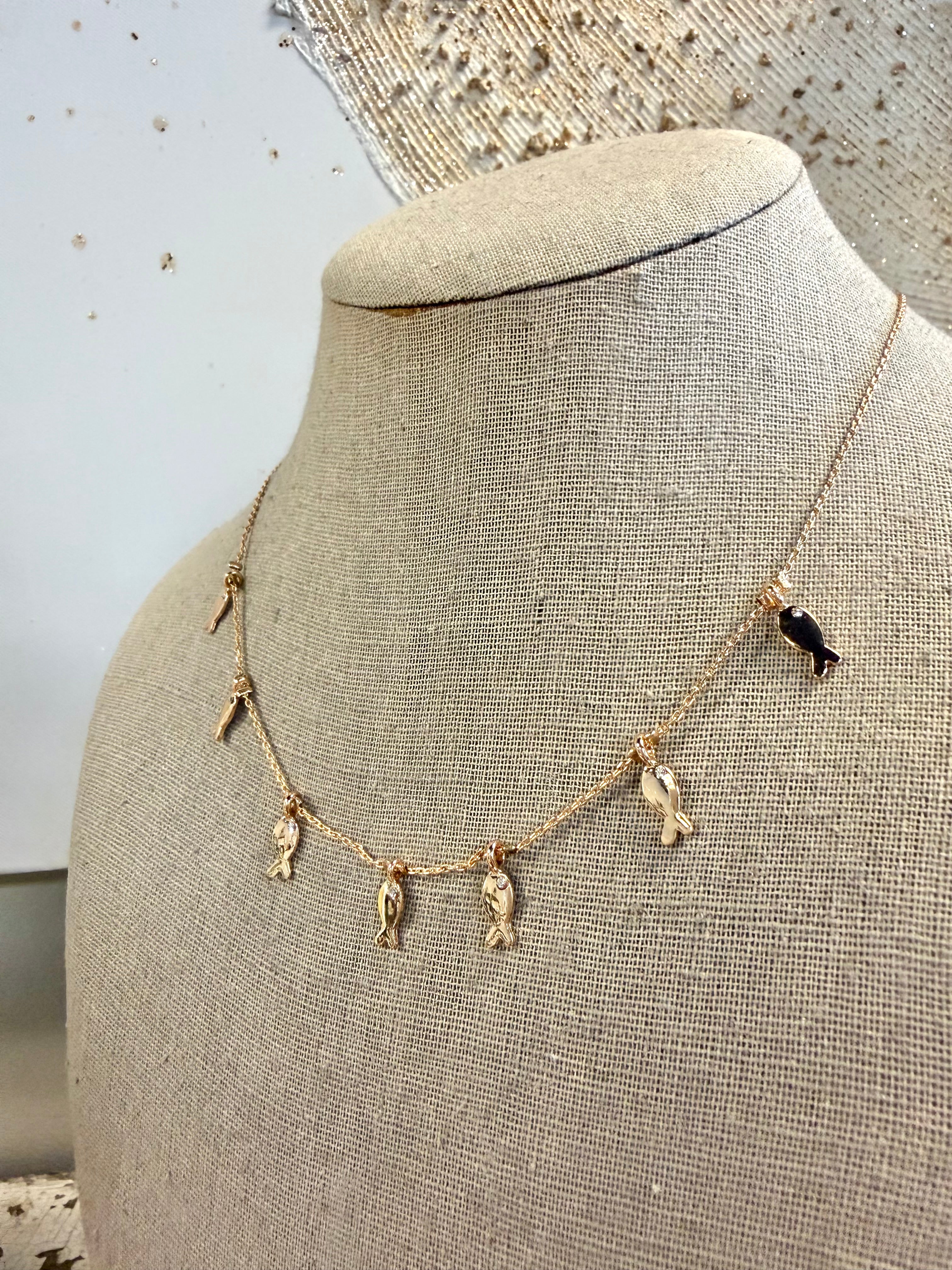 Delicate fish charm pendant stationed fine chain